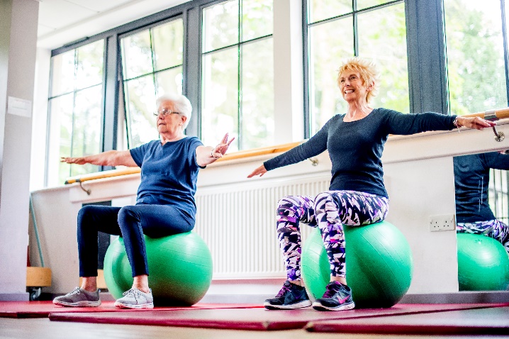 Two individuals exercising in a rehabilitation centre