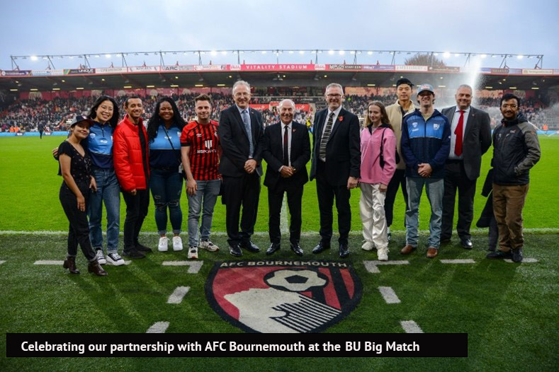 A group of people posing for a photo on a football field; senior management from Bournemouth University and AFC Bournemouth with international students