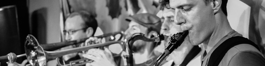 Musicians playing brass instruments in a band