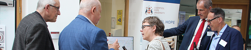 Photo of MP Engagement event. Showing Maria Eagle (Garston and Halewood) and Bill Esterson (South Sefton) engaging with academics