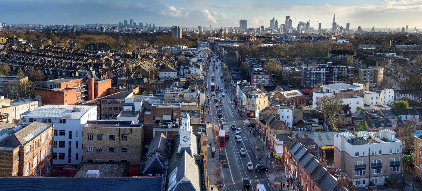 A view of London from the university's highest point on the Tower on Holloway Road. The viewer is looking right down Holloway Road towards Highbury and Islington, and beyond to the City of London in the distance.