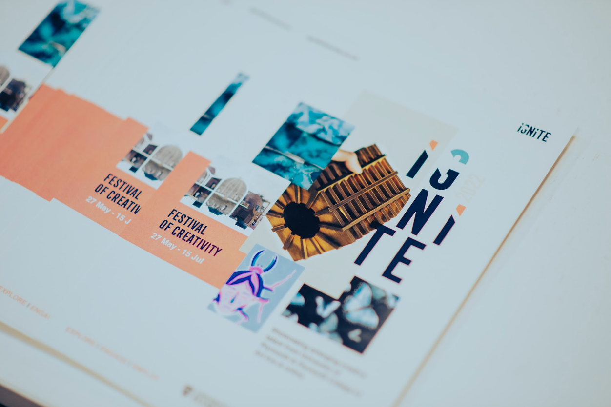 An image of a selection of leaflets on a table promoting the IGNITE Festival of Creativity.
