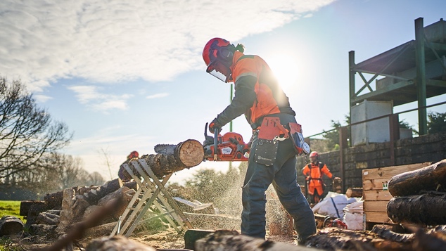 A student doing a chainsaw class as part of the JORIC