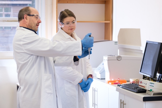 Dr Andrew Hemmings conducting equine research with a student
