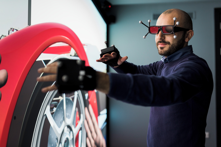 Figure 2 is an image of a man using augmented reality equipment in the Digital Innovation Facility's Mixed Reality Laboratory