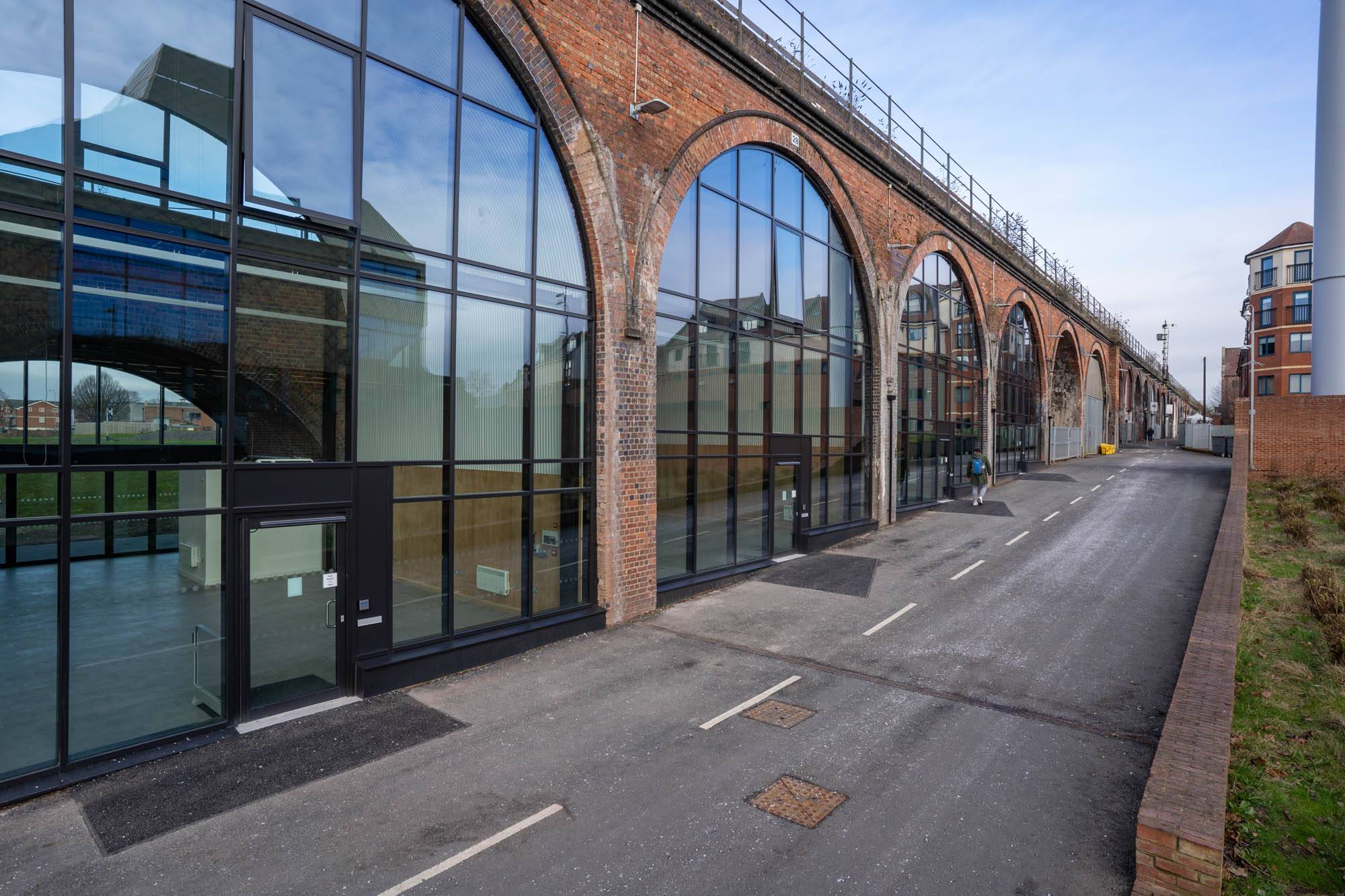 A picture of the renovated railway arches and of the pathway from the main rail station down to the River Severn.