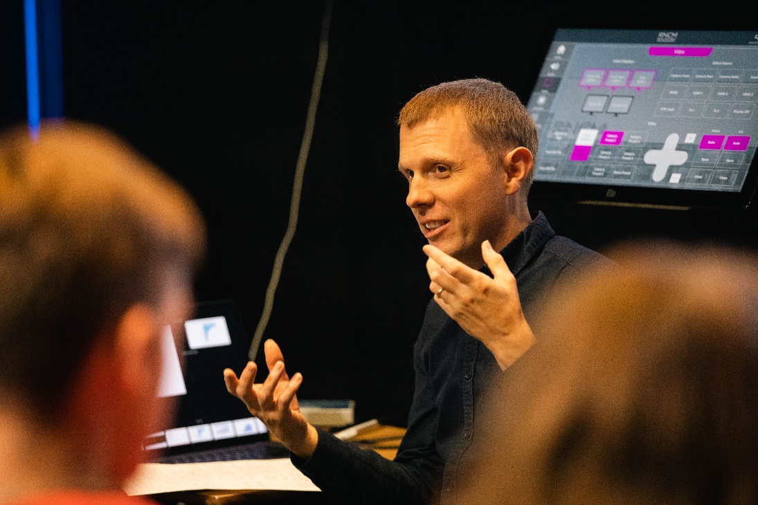 An RNCM popular music tutor talking about his research in a digital studio at the RNCM.