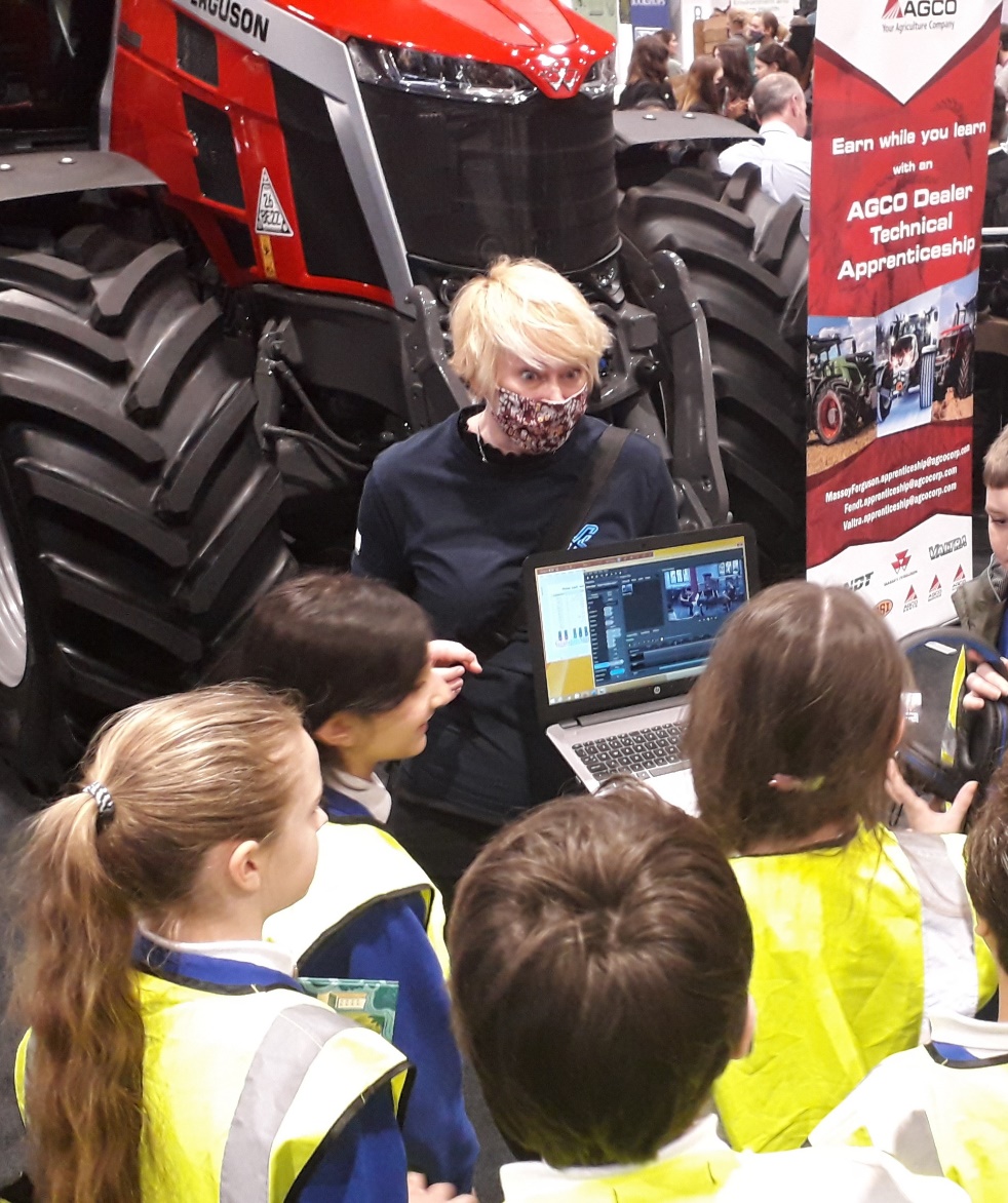 An RNCM researcher showing her work on music and mutation to school children.